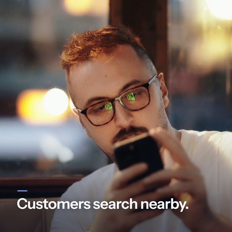 A short silent story. A man searches on his phone: "Customers search nearby." A woman in a car picks from her phone: "They pick from the top names." A customer walks into a flower shop: "We help put your name there." The owner greets him at the counter: "More calls. More visits."